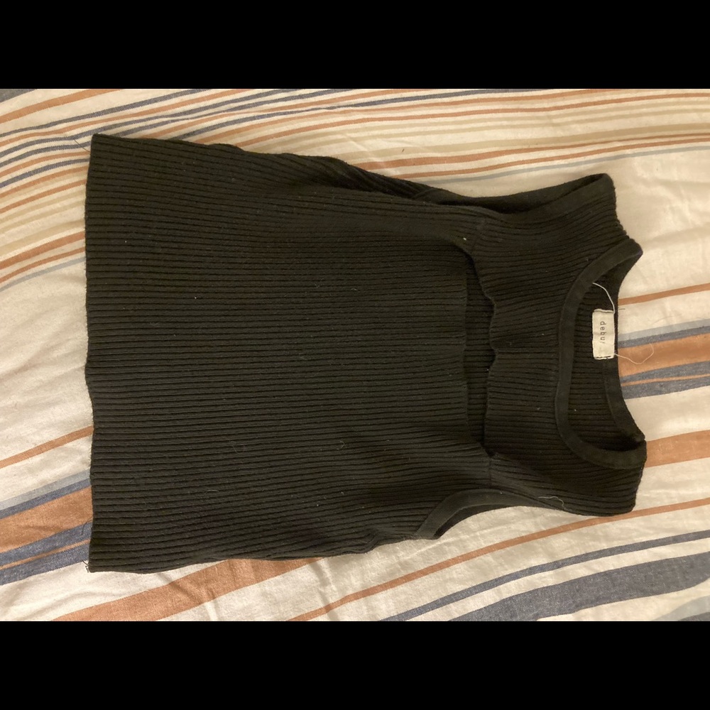 Black top with a slit in the bust